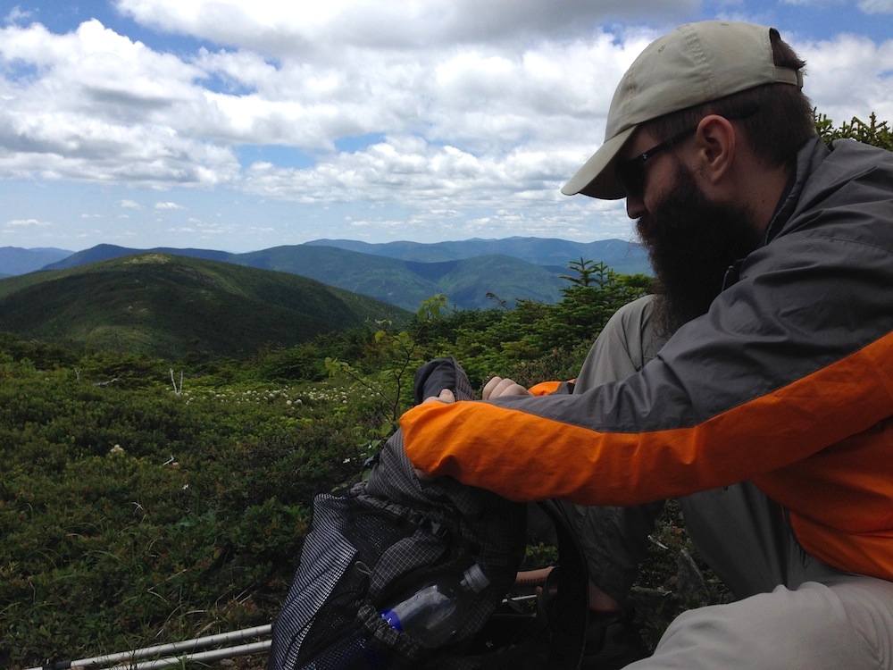 Mr. FW packing up our lunch, with a view of surrounding mountains